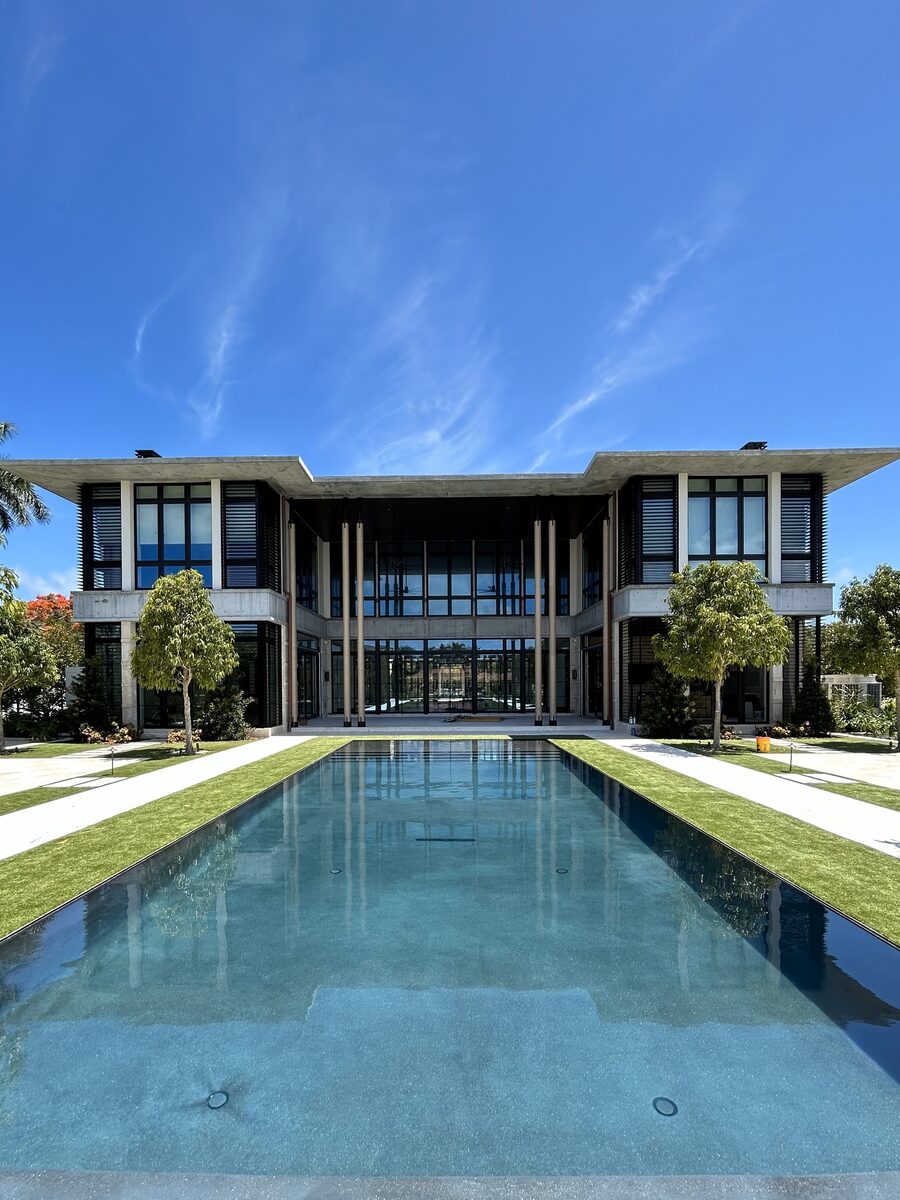 Gables Estates Residence luxury custom home with reflecting pool and covered terrace