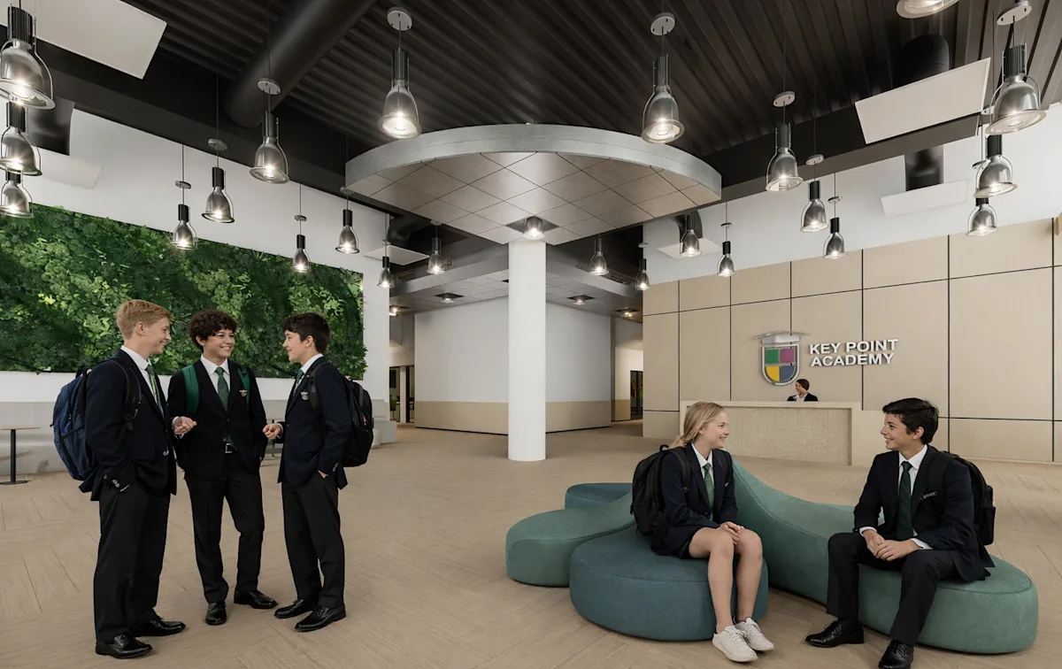 International School of Biscayne lobby with students, living green wall, and reception desk