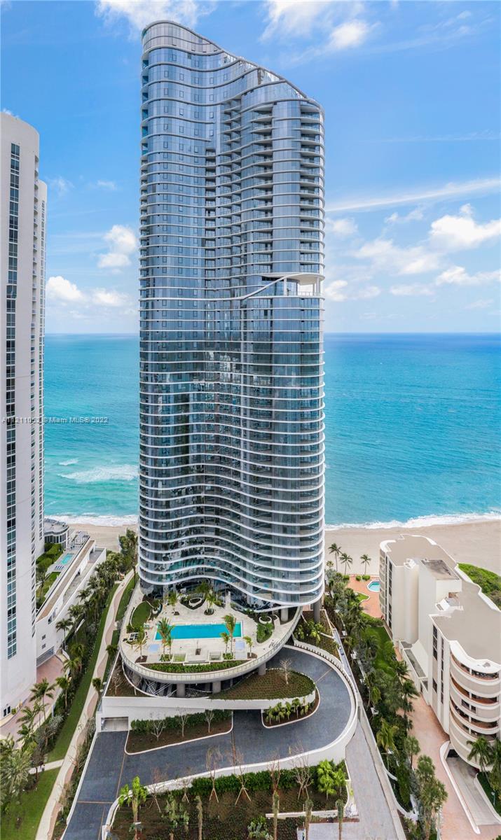 Ritz Carlton Residences oceanfront condominium tower with curved balconies in Sunny Isles Beach